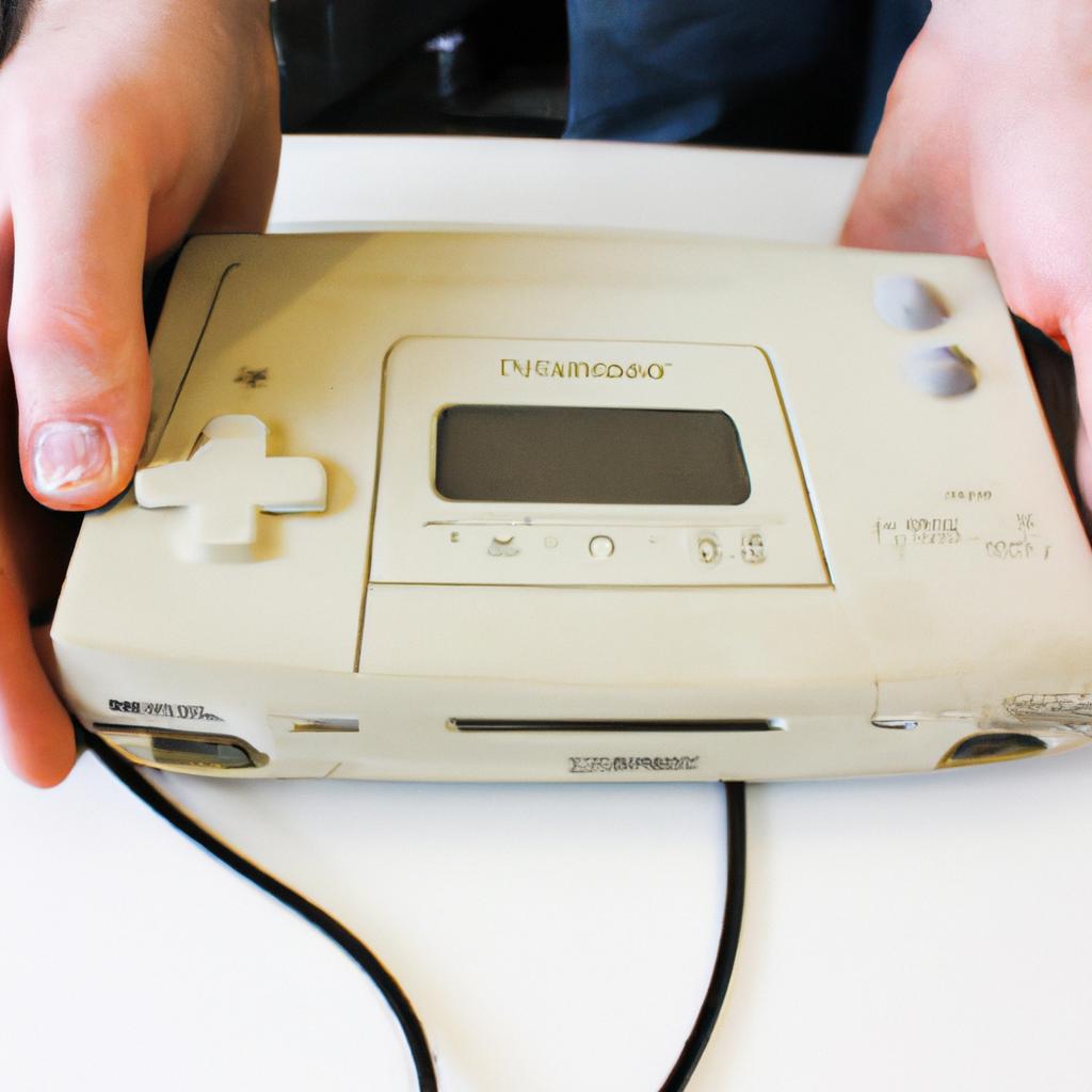 Person holding retro gaming console