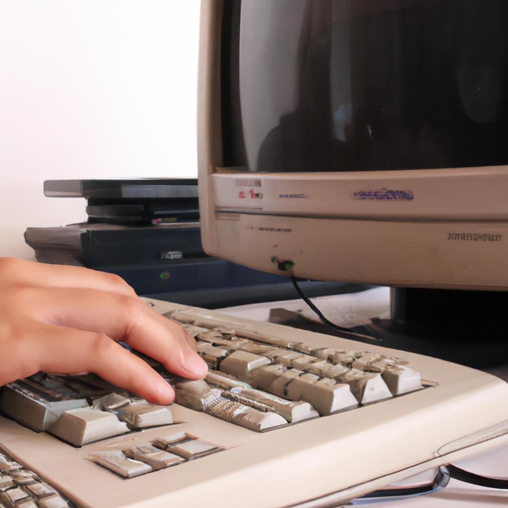 Person using old computer equipment